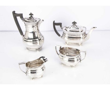 A 1960s silver four piece silver tea set by James Dixon &amp; Sons, 65.7 ozt, Sheffield 1966, with applied black handles to t