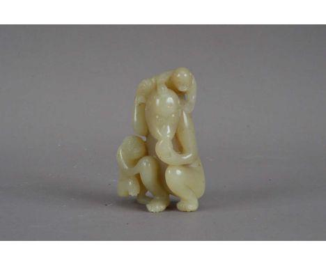 A Chinese jade figurine, depicting a monkey and her infants, one leg broken, AF, 7.5cm highAs catalogued one of the infants f