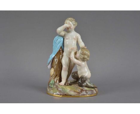 A 19th century Meissen porcelain figurine of a cherub and young satyr,  the cherub naked next to a tree stump (one finger bro