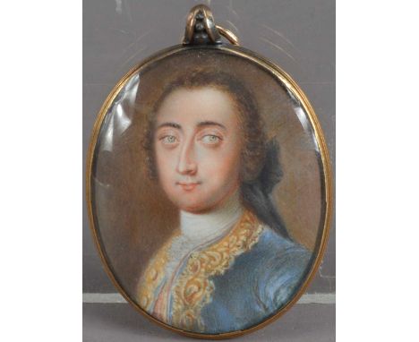 An 18th century Portrait miniature locket on ivory of a Georgian man, with brown wig, blue jacket with gilt collar and lapels