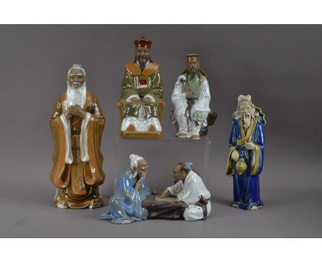 A collection of Chinese ceramic figures, of differing sizes and poses, the tallest, 30.5cm high (5)