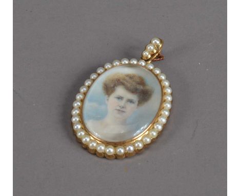 An early 20th century Portrait miniature locket on ivory of a lady, in a 15ct. gold oval case with fresh water pearl beading,