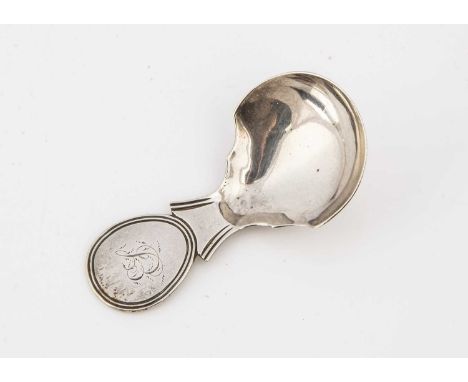 A Georgian period silver tea caddy spoon by JW, shaped bowl and with initials to handle
