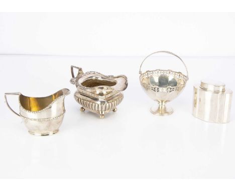 Four items of Victorian and later silver, including a tea caddy, two milk jugs and a swing handled bon bon dish, 19.74 ozt (4