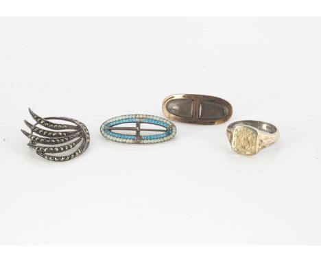 An early 19th Century double plaited hair mourning brooch of oval cushion shape, an enamel and silver buckle brooch, a silver