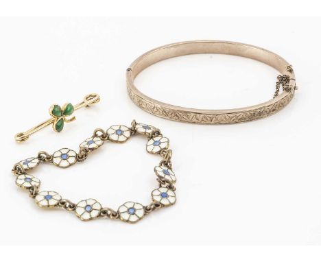 Three items of jewellery, including a Danish silver gilt and enamelled bracelet, a gold coloured bangle, and a gold coloured 