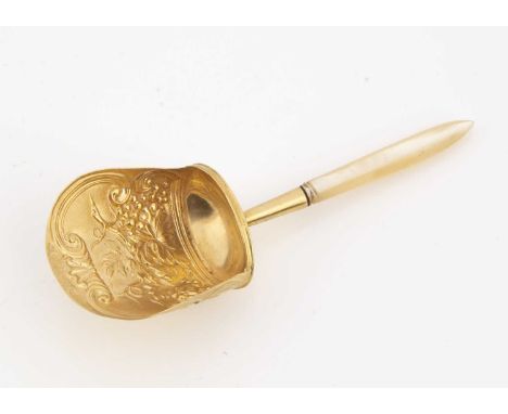 A Georgian period silver gilt and mother of pearl handled tea caddy spoon by Samuel Pemberton