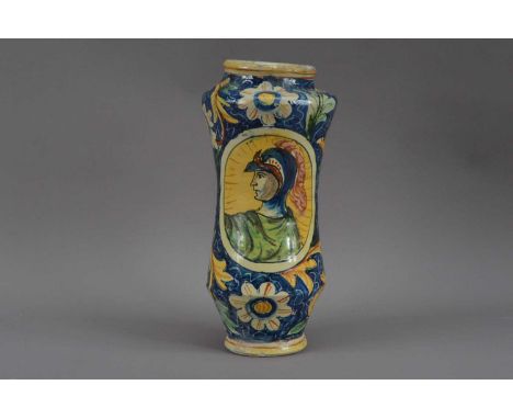 A 19th century Italian Majolica albarello jar, floral decoration on a blue ground with two oval portraits of Roman men, indis