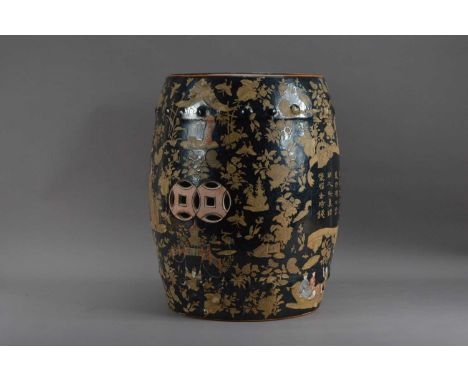 A modern Chinese ceramic stool, characters and floral design on a black ground, modern mark to the underside, 46cm H x 32cm W