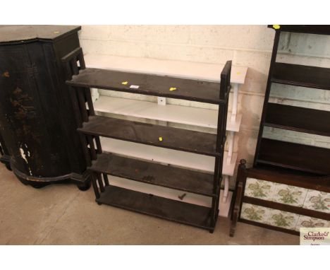 A graduated wall shelf and a free standing shelf