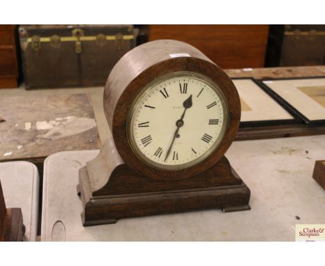 Webster of Cornhill, an oak cased balloon shaped mantel clock in need of attention 