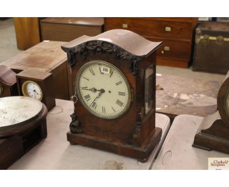 A Victorian mahogany mantel clock having double fuseé movement, engraved back plate, carved decoration to the front, in need 