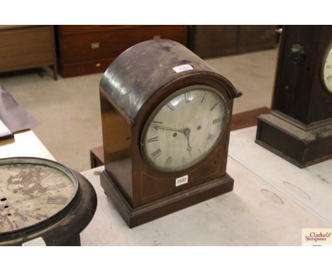 A late 19th / early 20th Century mahogany cased mantel clock, 8-day movement, striking on a  gong in need of restoration 