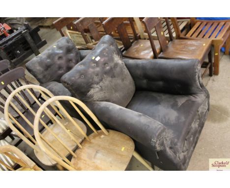 A pair of vintage leatherette button back easy chairs