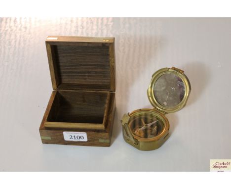 A brass compass by Stanley of London in wooden and brass mounted case
