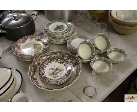 A quantity of Spode plates and a large dish decorated with game birds and a quantity of Masons game bird plates and soup bowl