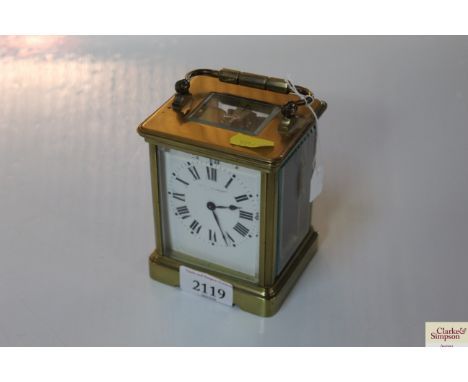 A late 19th Century brass cased carriage timepiece, white enamel Roman numeral dial