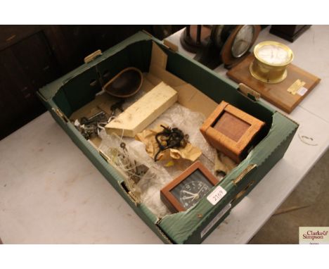 A collection of various clock parts; a Ministry of Defence quartz chromometer; a carriage clock case etc. 