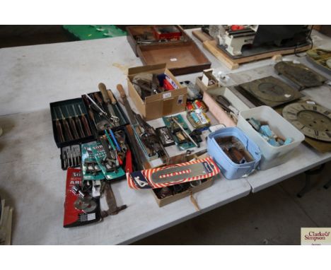 A large quantity of various component clock parts, tools etc. 