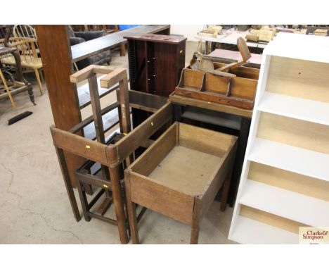 A quantity of wooden table bases; a stool base; modern CD rack etc