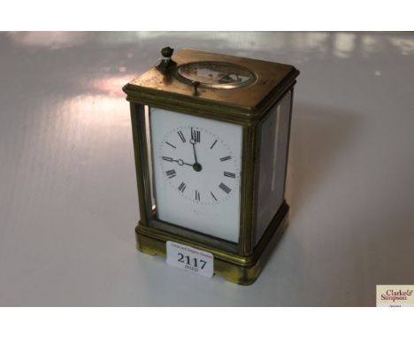 A 19th Century brass cased French carriage clock having repeat movement, impress mark to the reverse D.C.(handle missing)
