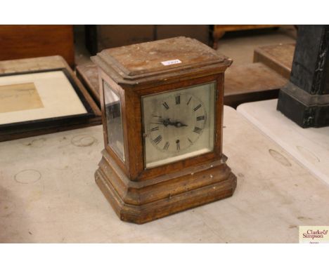 A 19th Century oak cased single fuseé mantel clock in need of restoration