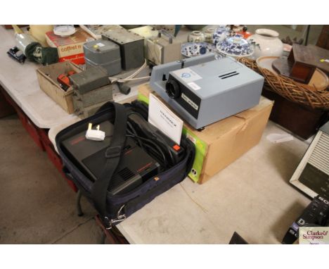 A Boots Turbo projector and a Hanimex slide projector, sold as seen