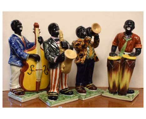 Four ceramic figurines modelled as jazz musicians, largest 33cm high  