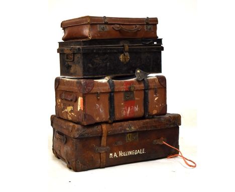 Large vintage leather trunk, a canvas covered suitcase, one other suitcase and a metal document trunk  