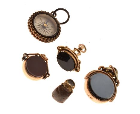Group of five gold, yellow metal and unmarked fobs, to include; two bloodstone and carnelian swivel seals, two further seals 