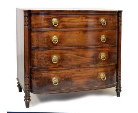 Early 19th Century mahogany bowfront chest of four long drawers having turned pilasters fitted brass ring handles, 115cm wide