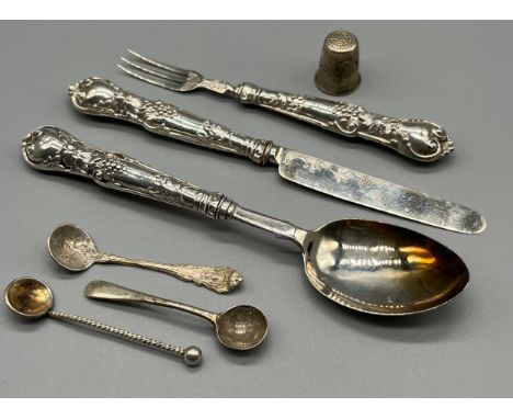 A Lot of silver flatwares to include a matching three piece Georgian Birmingham Spoon, Fork and knife set, Three condiment si