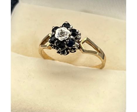 A 9ct gold sapphire and diamond ring. [Ring size Q] 