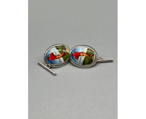 A Pair of silver and enamel golfing cufflinks. 