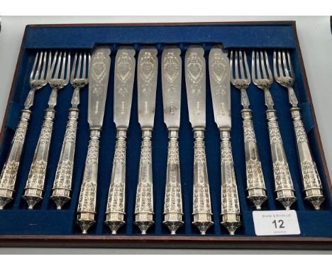 A Victorian silver plated fork and knife set.