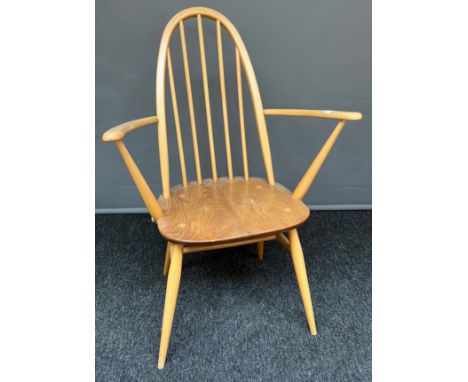 A vintage blonde ercol arm chair. 