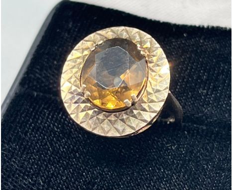 A 9ct gold ring set with a Smokey Quartz stone. [Ring size M] [5.87Grams] 