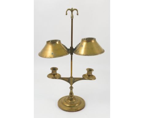 A brass adjustable table light, the two branches having adjustable candle holders with adjustable shades above, raised on a s