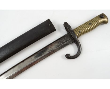 A 19th century French 1866 Sabre bayonet, the blade engraved St Etienne 1872, with scabbard