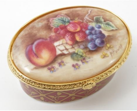 A cased Royal Worcester limited edition oval box, the hinged lid painted with fruit to a mossy background by M Powell, with f