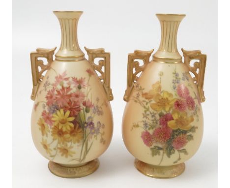 A pair of Royal Worcester blush ivory vases, decorated with flowers, with pierced handles, shape number 1539, dated circa 190