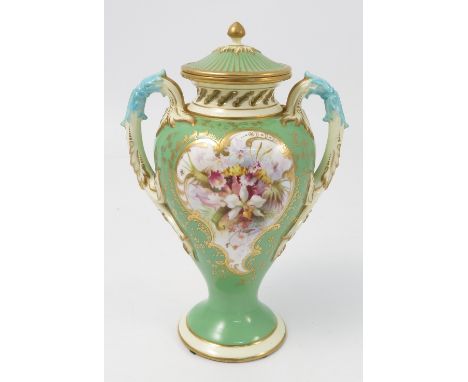 A Royal Worcester covered vase, decorated with a green ground reserving a panel of flowers by Powell, made for Tiffany & Co N