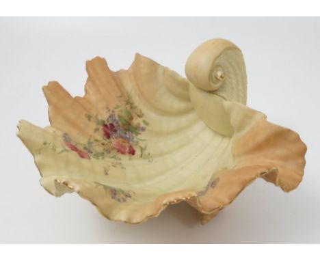 A Royal Worcester blush ivory clam shell bowl, with naturalistically moulded body, raised on three periwinkles, interior deco