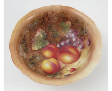 A Royal Worcester bowl, the interior decorated with fruit to a mossy background by J Cook, unfinished, diameter 9ins