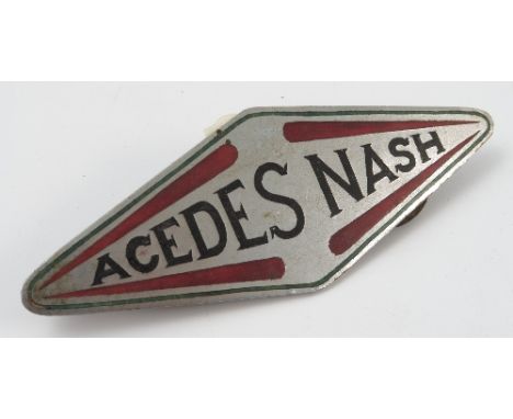A Acdes Nash car badge, of diamond form with enamel colours, width 4.25ins