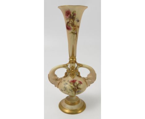 A Royal Worcester blush ivory pedestal vase, decorated with thistles, having dolphin moulded handles, shape number 1749, date