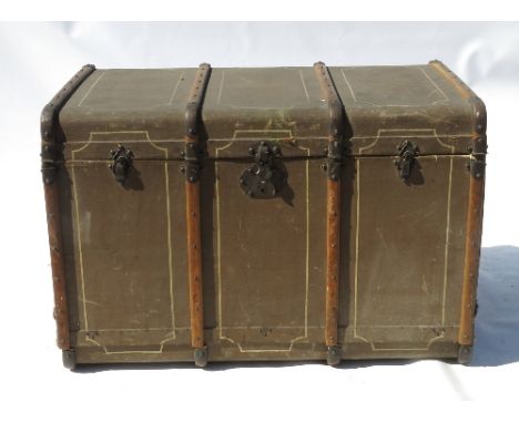 A late 19th century motoring trunk, opening to reveal a fitted interior with drawers, and straps embroidered 'Au Touriste' an
