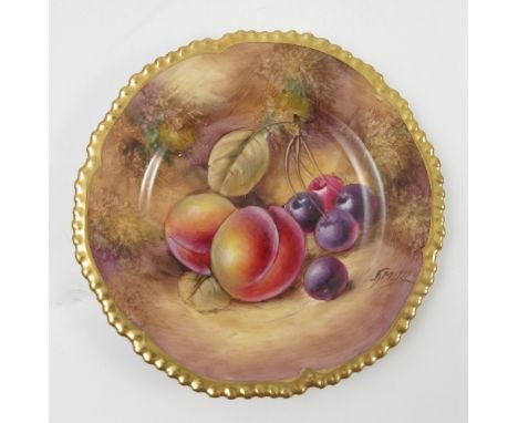 A Royal Worcester side plate, decorated with fruit to a mossy background by J Smith, with shaped gilt edge, diameter 5.75ins
