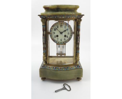 A late 19th century French gilt brass, champleve enamel and onyx four glass mantel clock, the movement striking on a coil, st