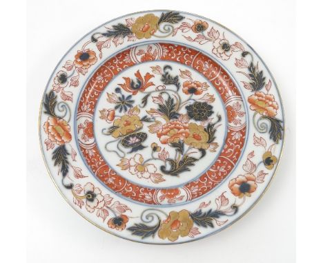 A Chinese Kangxi porcelain plate, decorated in reds, blues and gilt with flowers and leaves, diameter 9ins